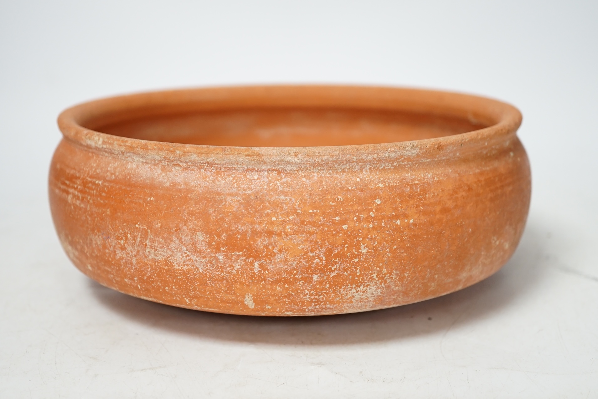 A Roman terra sigillata circular pottery bowl, c.1-300AD, top rim 20cm diameter. Condition - good for age, wear to edge of top rim as to be expected